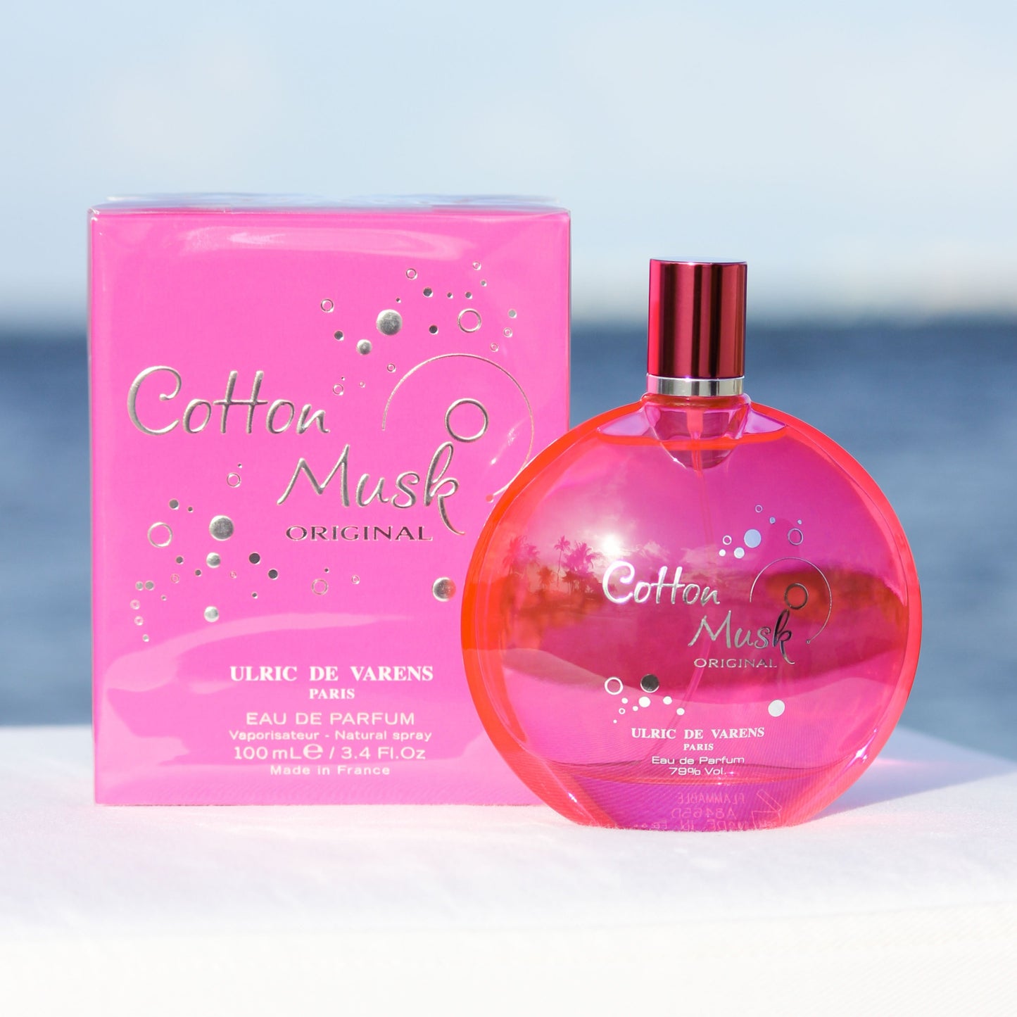 Ulric De Varens Cotton Musk women's perfume 3.4 EDP in front of beach