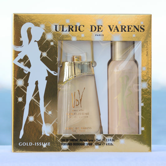 Ulric De Varens Gold-issime Gift Set women's perfume 2.5 EDP and deodorant 4 oz in front of beach