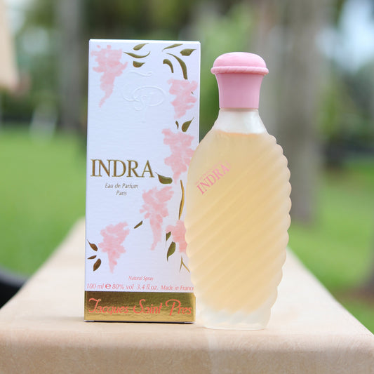 Jacques Saint Pres Indra women's perfume 3.4 EDP in front of trees