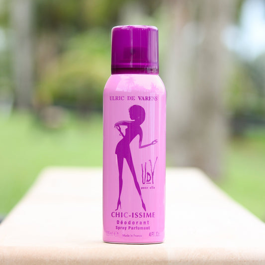 Ulric De Varens Chic-issime women's perfume scented deodorant 4 oz in front of trees.