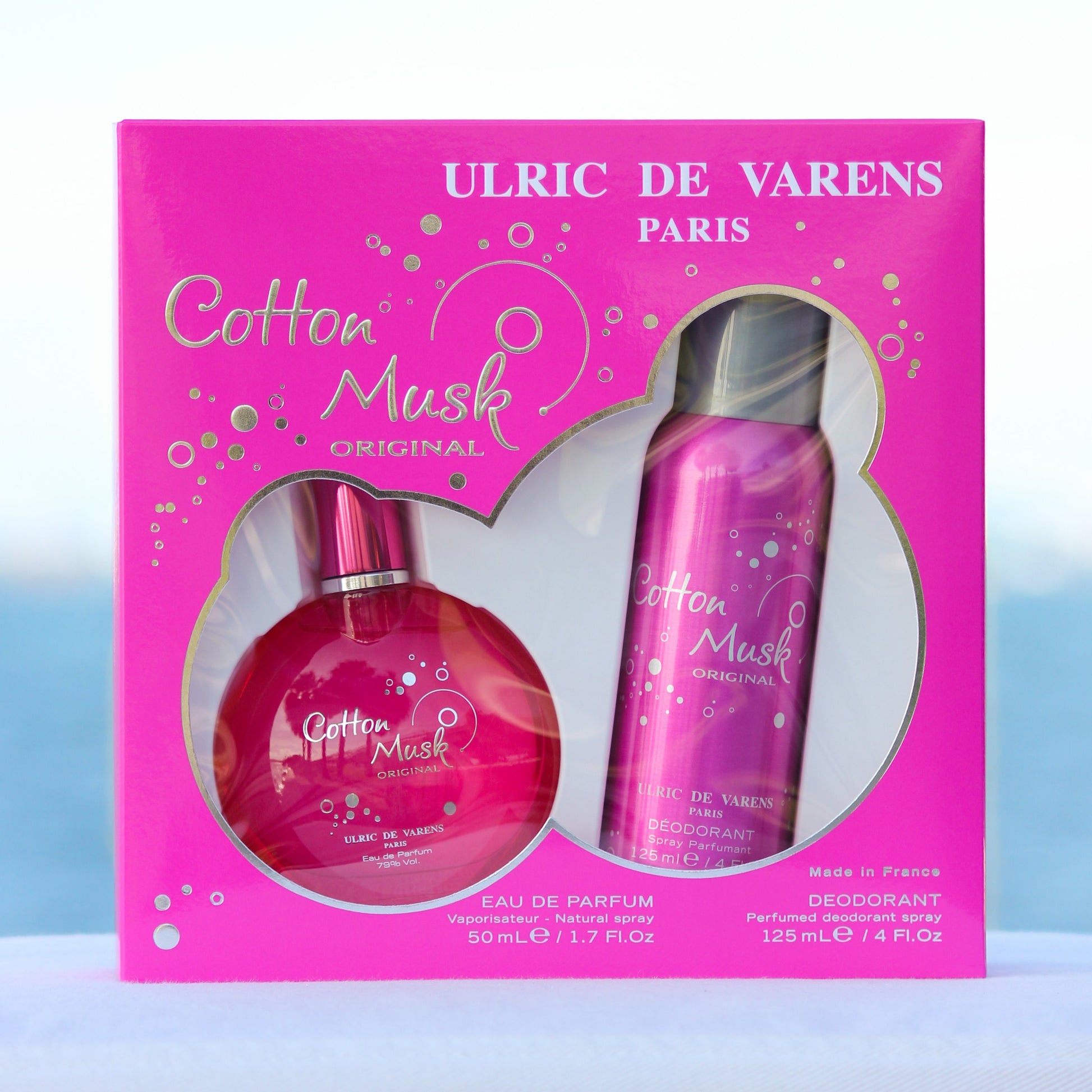 Ulric De Varens Cotton Musk Gift Set women's perfume 1.7 EDP and deodorant 4 oz in front of beach