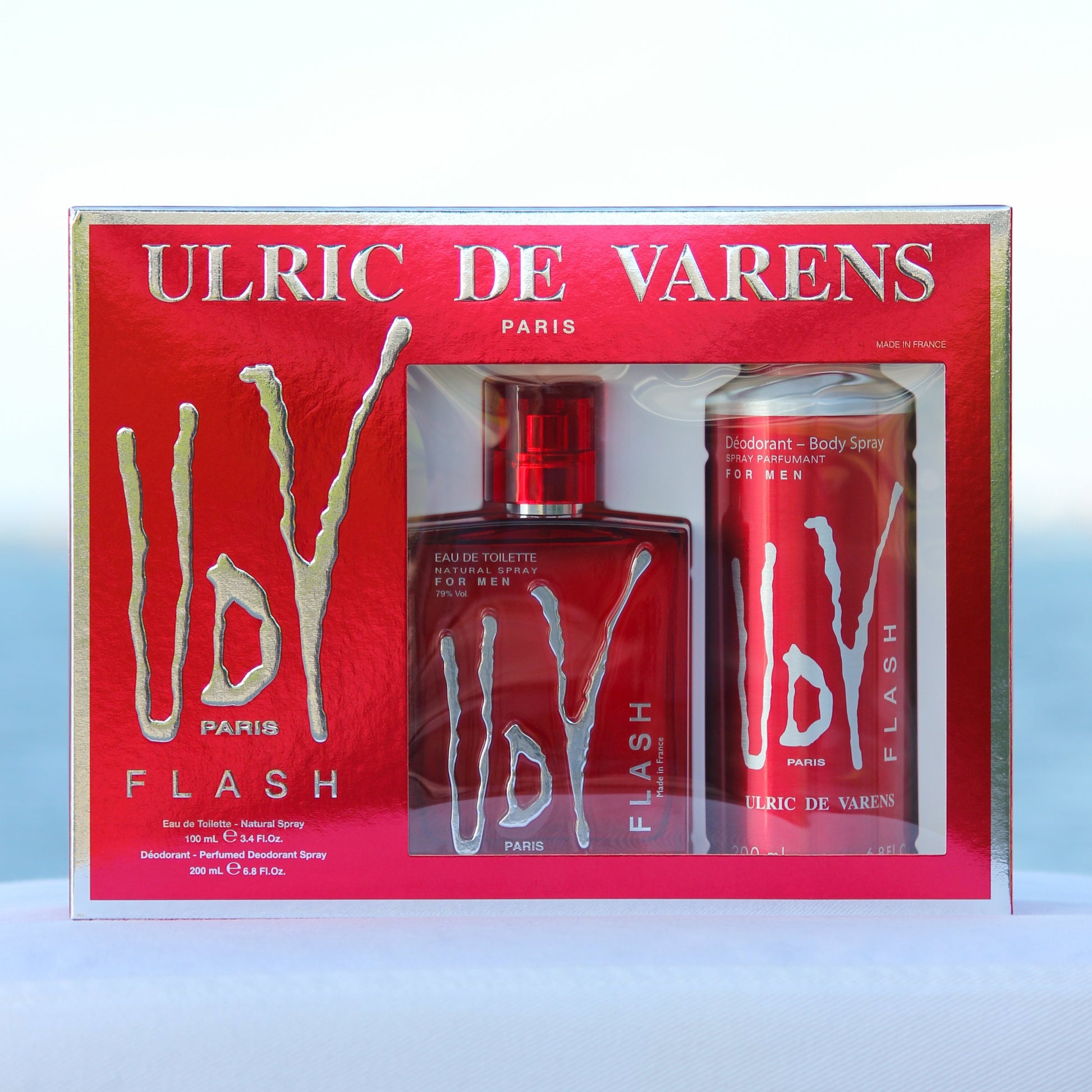 Ulric De Varens UDV Flash Gift Set men's perfume 3.4 EDT and deodorant 6.8 oz in front of beach