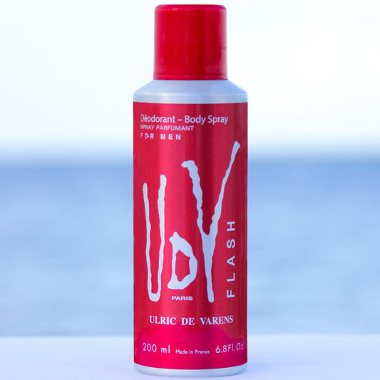 Ulric De Varens UDV Flash men's perfume scented deodorant 6.4 oz in front of beach