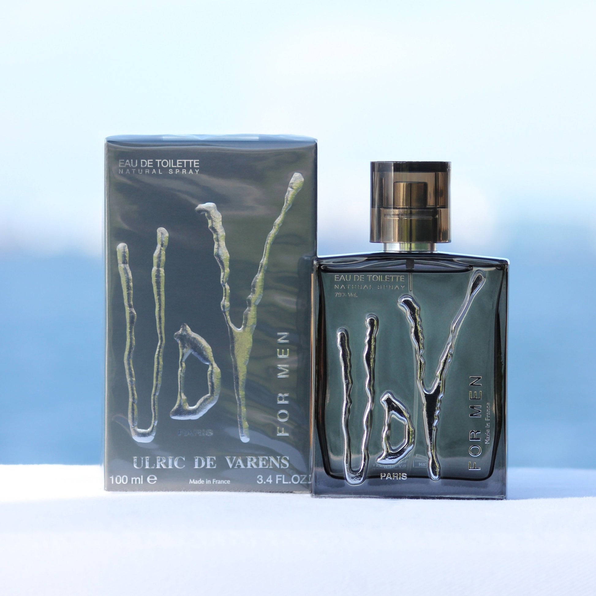 Ulric De Varens UDV For Men perfume 3.4 EDT in front of beach