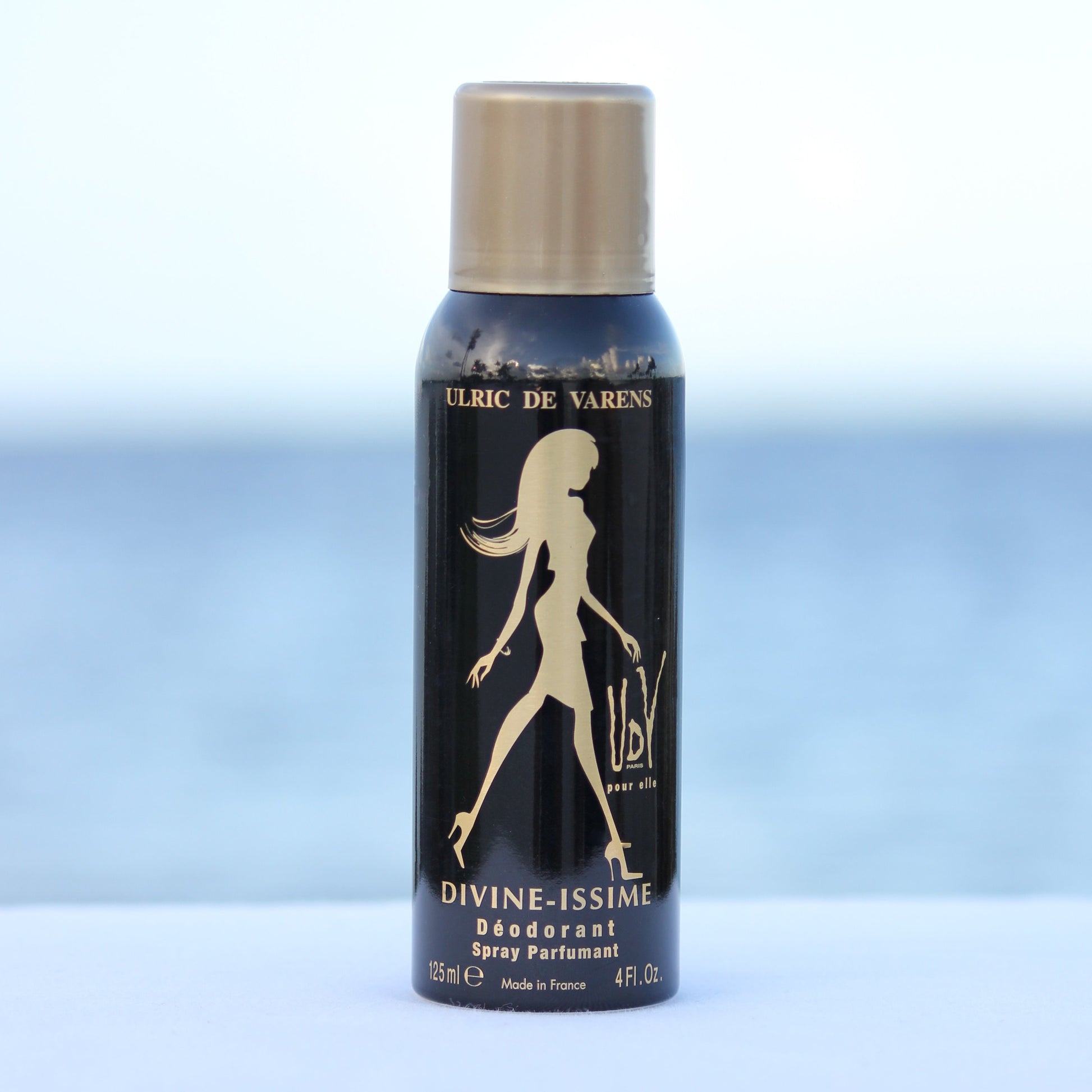 Ulric De Varens Divine-issime women's perfume scented deodorant 4 oz in front of beach