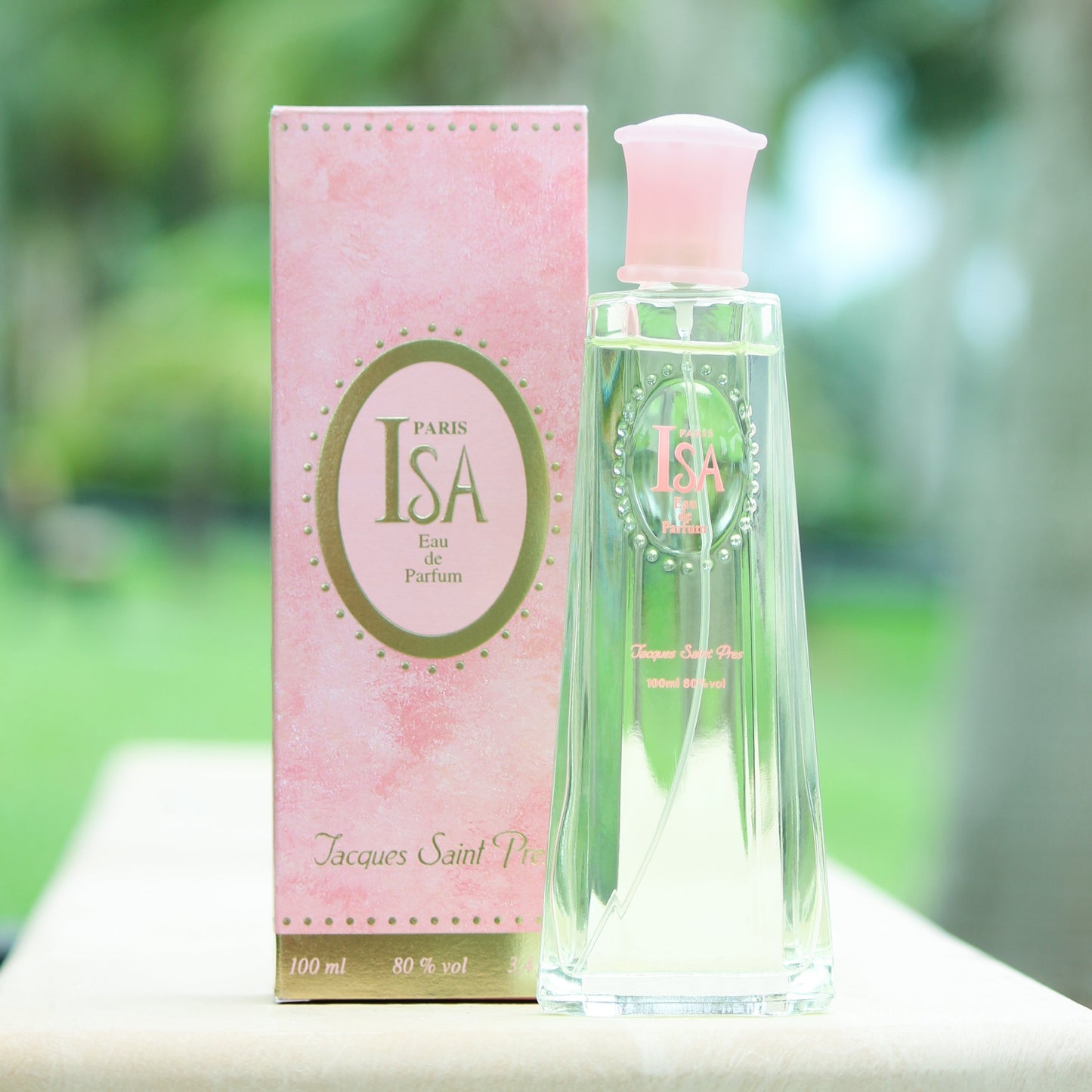 Jacques Saint Pres Isa women's perfume 3.4 EDP in front of trees