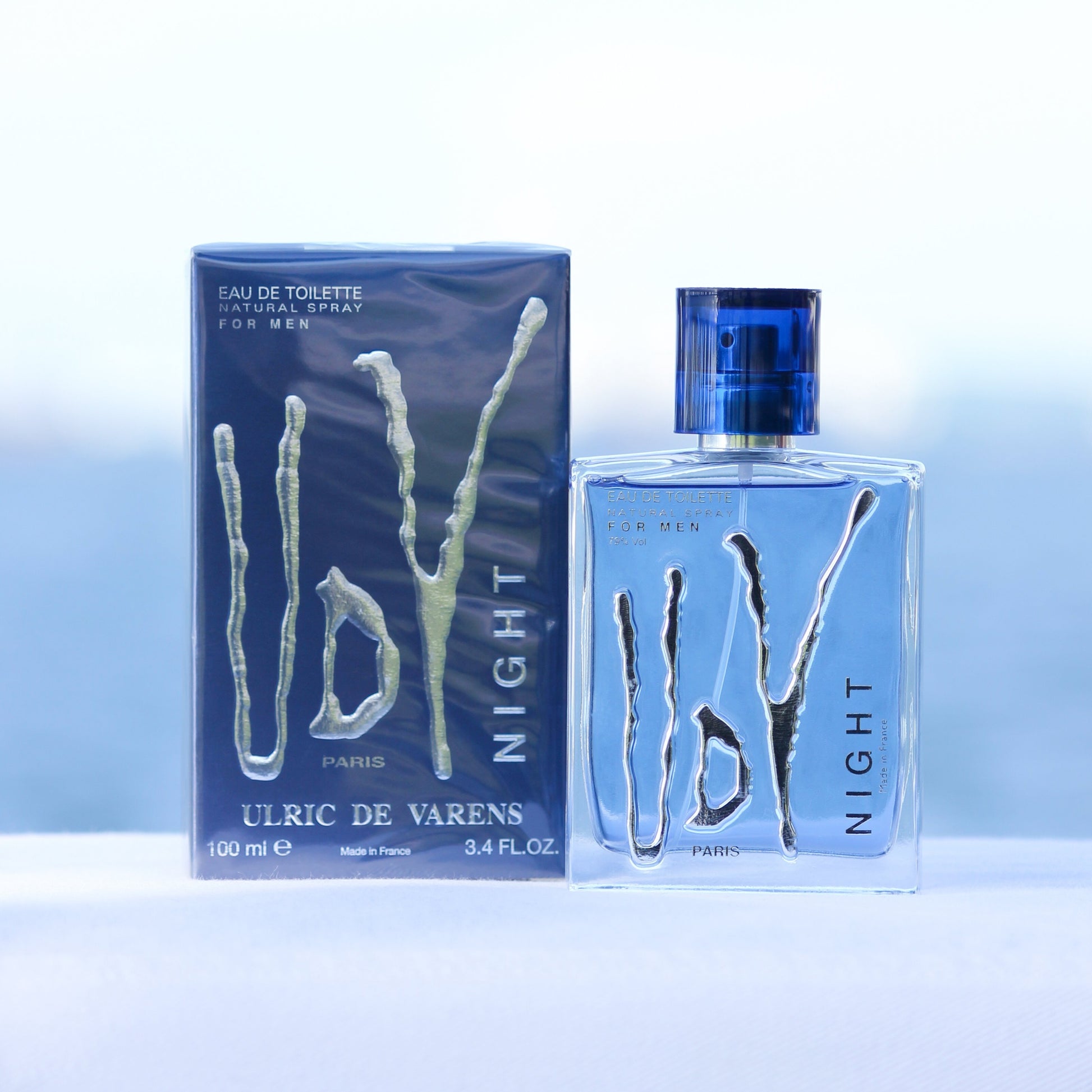 Ulric De Varens UDV Night men's perfume 3.4 EDT in front of beach