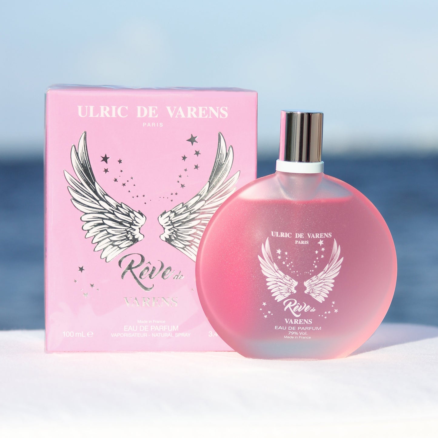 Ulric De Varens Reve De Varens women's perfume 3.4 EDP in front of beach