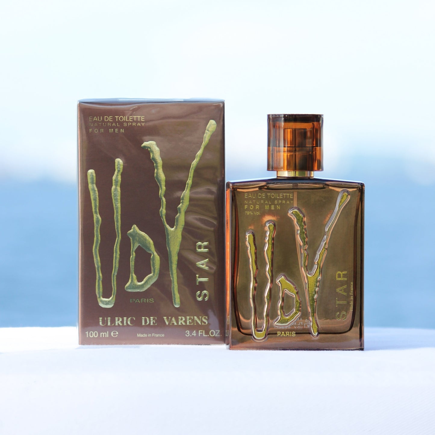 Ulric De Varens UDV Star men's perfume 3.4 EDT in front of beach