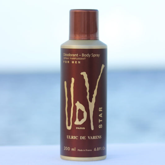Ulric De Varens UDV Star men's perfume scented deodorant 6.4 oz in front of beach