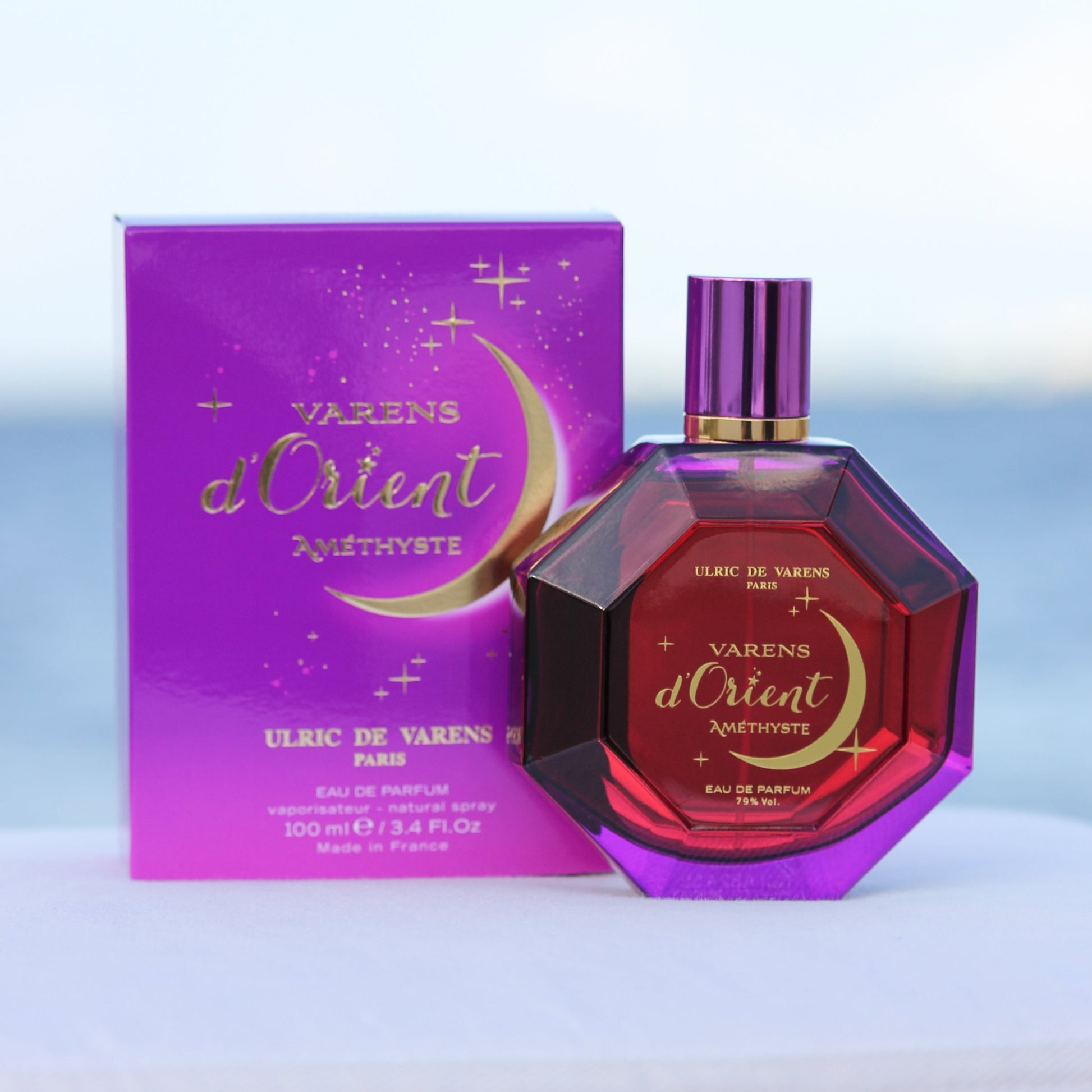 Ulric De Varens Varens d'Orient Amethyste women's perfume 3.4 EDP in front of beach